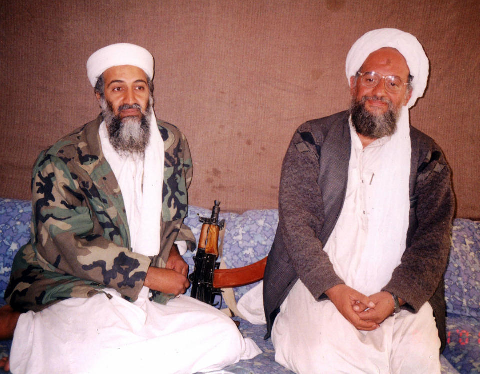 Al Qaeda leader Osama bin Laden, left, sits with his adviser Ayman al-Zawahiri, during an interview with a Pakistani journalist at an undisclosed location in Afghanistan for an article published Nov. 10, 2001. / Credit: Getty Images