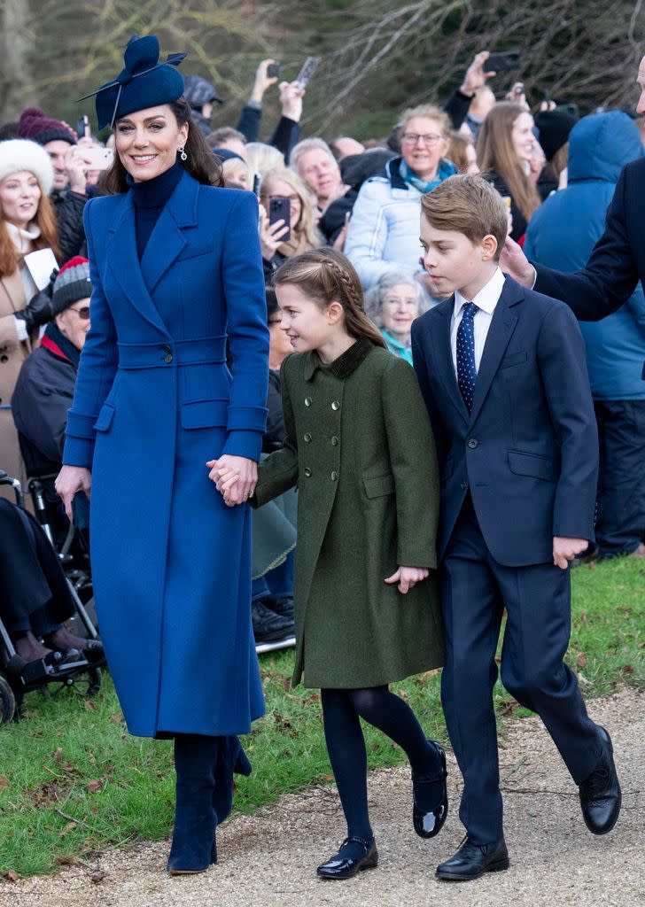 Catherine, Princess of Wales (L) with Prince George of Wales (R) and Princess Charlotte of Wales (C) attend the Christmas Day service at St Mary Magdalene Church on December 25, 2023 in Sandringham, Norfolk.