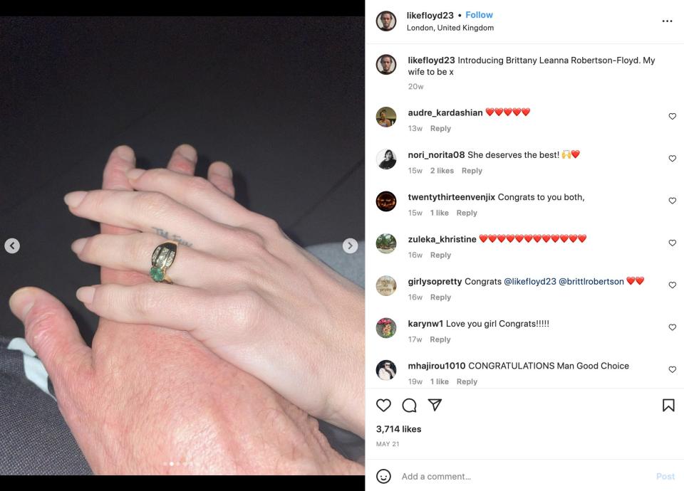 The hands of Britt Robertson and Paul Floyd after getting engaged.