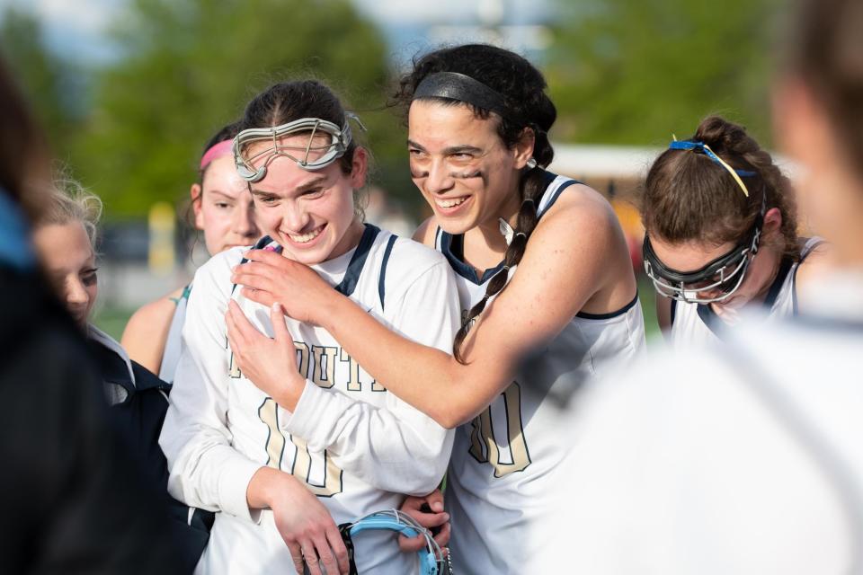 Council Rock South's Amy Loving, left, and Karissa Smedley celebrate their win after a girls lacrosse game against Council Rock North at Council Rock South in Northampton Township on Wednesday, May 3, 2023. South upended rival North 13-7