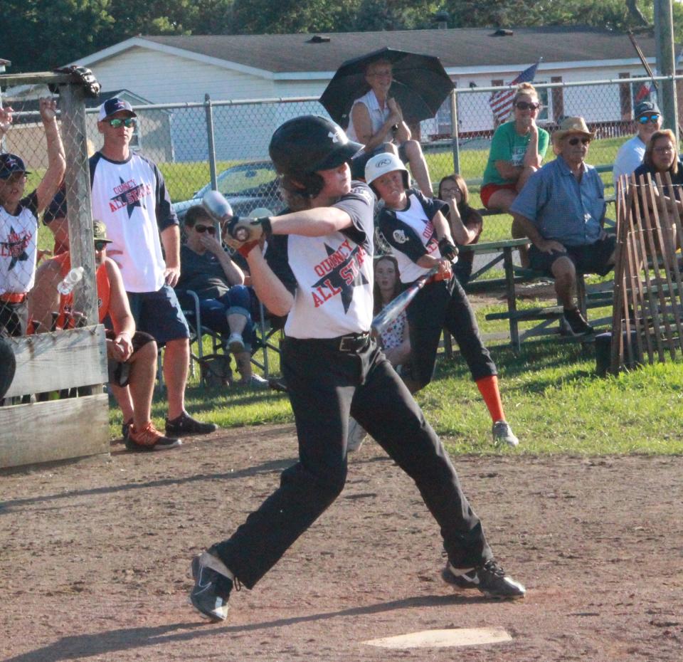 Quincy's Bryson Estlow swings for the fences Wednesday versus Union City at the Branch County Fair