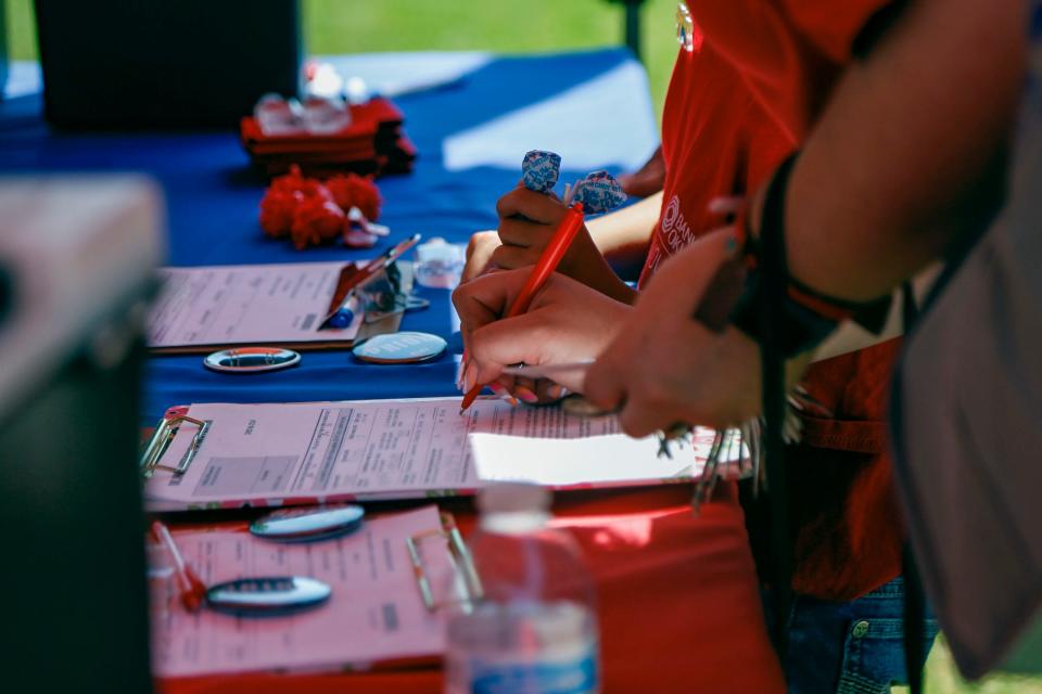 Rock the Native Vote hosts a tent at the Price Alliance festivities in Scissortail Park to entourage attendees to register to vote and encourage political participation in Oklahoma City on Saturday.