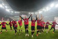 Leverkusen's Granit Xhaka celebrates with team mates after the German soccer cup match between Bayer 04 Leverkusen and Fortuna Duesseldorf in Leverkusen, Germany, April 3, 2024. (AP Photo/Martin Meissner)