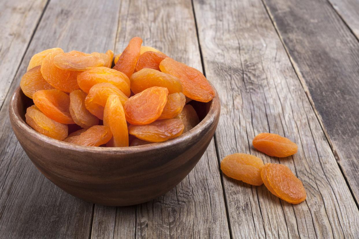 dried fruits with nuts in wooden bowl