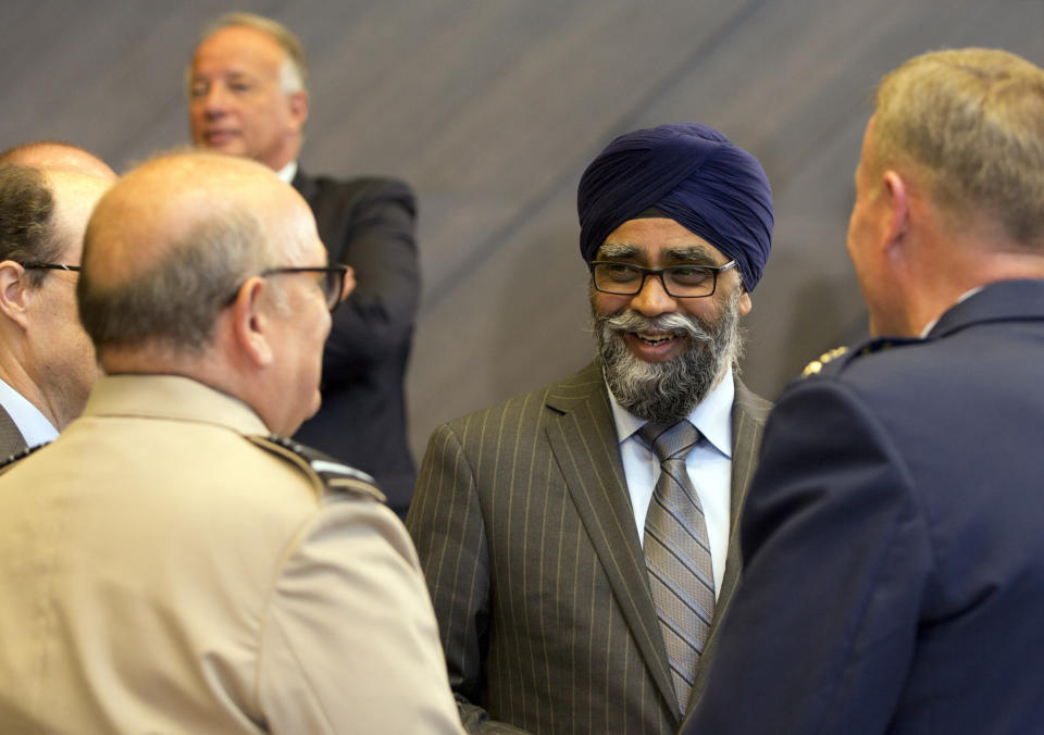 Canadian Defense Minister Harjit Singh Sajjan, center, attends a meeting of NATO defense ministers at NATO headquarters in Brussels, Wednesday, June 26, 2019. (AP Photo/Virginia Mayo)