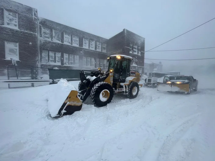 A generator was dragged through a blizzard on a payloader to power a shelter in Buffalo, NY.