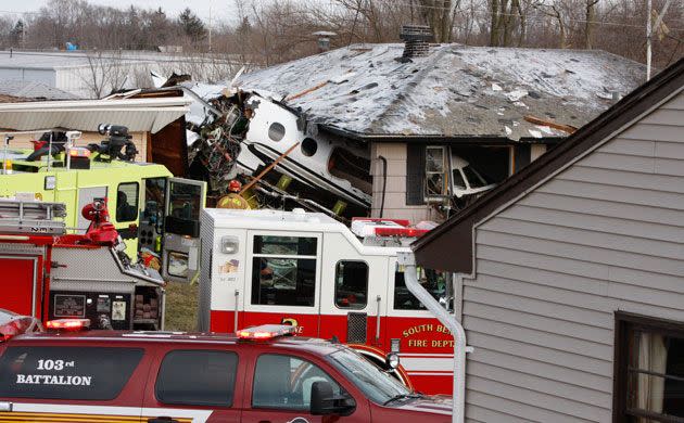 The front end of a Hawker Beachcraft Premier jet sits in a room of a home on Iowa Street in Indiana. Photo: AP/South End Tribune