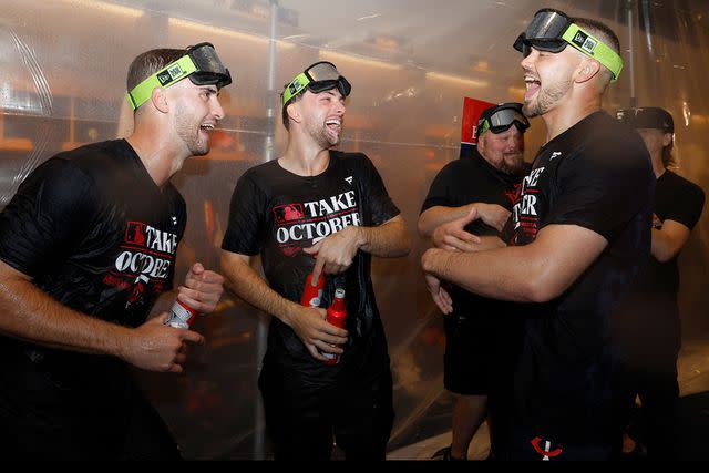 <p>David Berding/Getty</p> Matt Wallner, Edouard Julien, and Trevor Larnach celebrate the Minnesota Twins victory against the Toronto Blue Jays