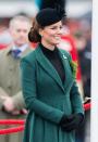 <p>The late Queen Mother’s gold shamrock brooch completed the look. <em>[Photo: PA]</em> </p>