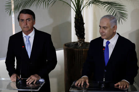 Israeli Prime Minister Benjamin Netanyahu speaks next to Brazil's President-elect Jair Bolsonaro after a lunch in Rio de Janeiro, Brazil December 28, 2018. Leo Correa/Pool via REUTERS