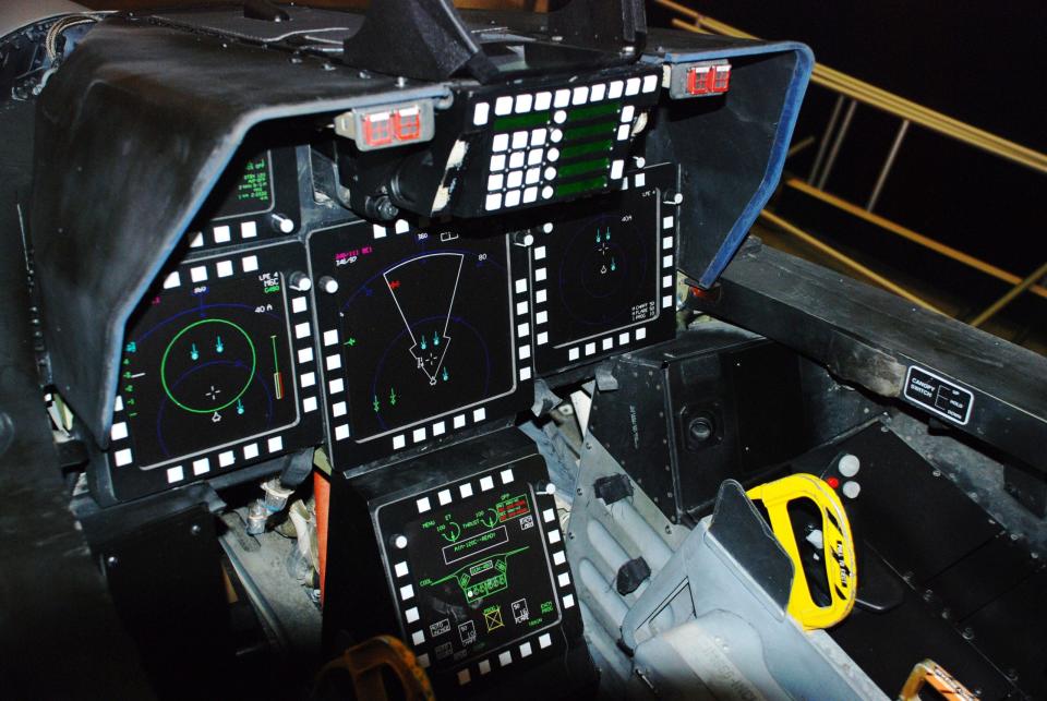 A representation of the F-22A's cockpit that was something of a bridge from the hybrid MFD-traditional gauge dominated cockpits of 4th generation fighters and the wide-area display-centric cockpit of the F-35. The F-22's cockpit was built around the principle of sensor fusion and is excellent at providing the pilot with excellent situational awareness and all the data needed to make quick tactical decisions. (NMOTUSAF)