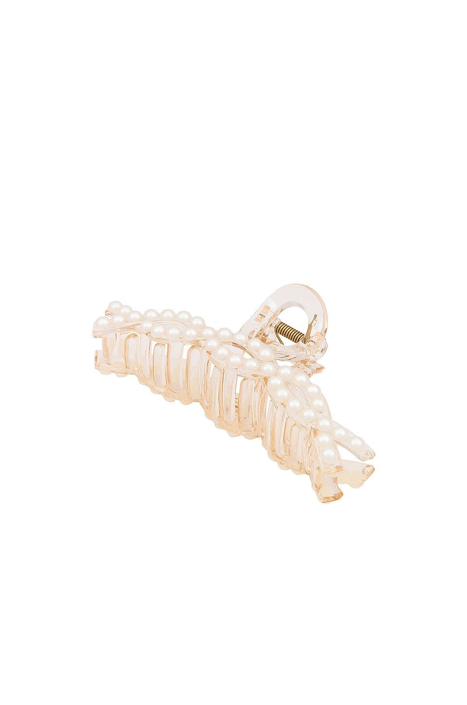 <p><strong>8 Other Reasons</strong></p><p>revolve.com</p><p><strong>$28.00</strong></p><p>If you don't want to have pearl-adorned hair accessories in your life, I'm just not sure what we have in common. This design is perfect for making a stranger fall in love with you at a holiday party.</p>