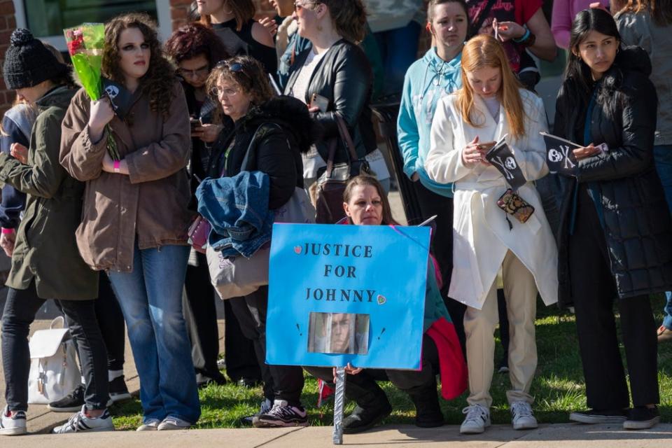 Fans wait for the arrival of Johnny Deep on day one of the trial (EPA)