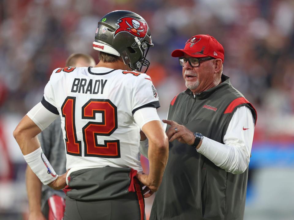 Tom Brady and Bruce Arians talk before a game against the Dallas Cowboys.