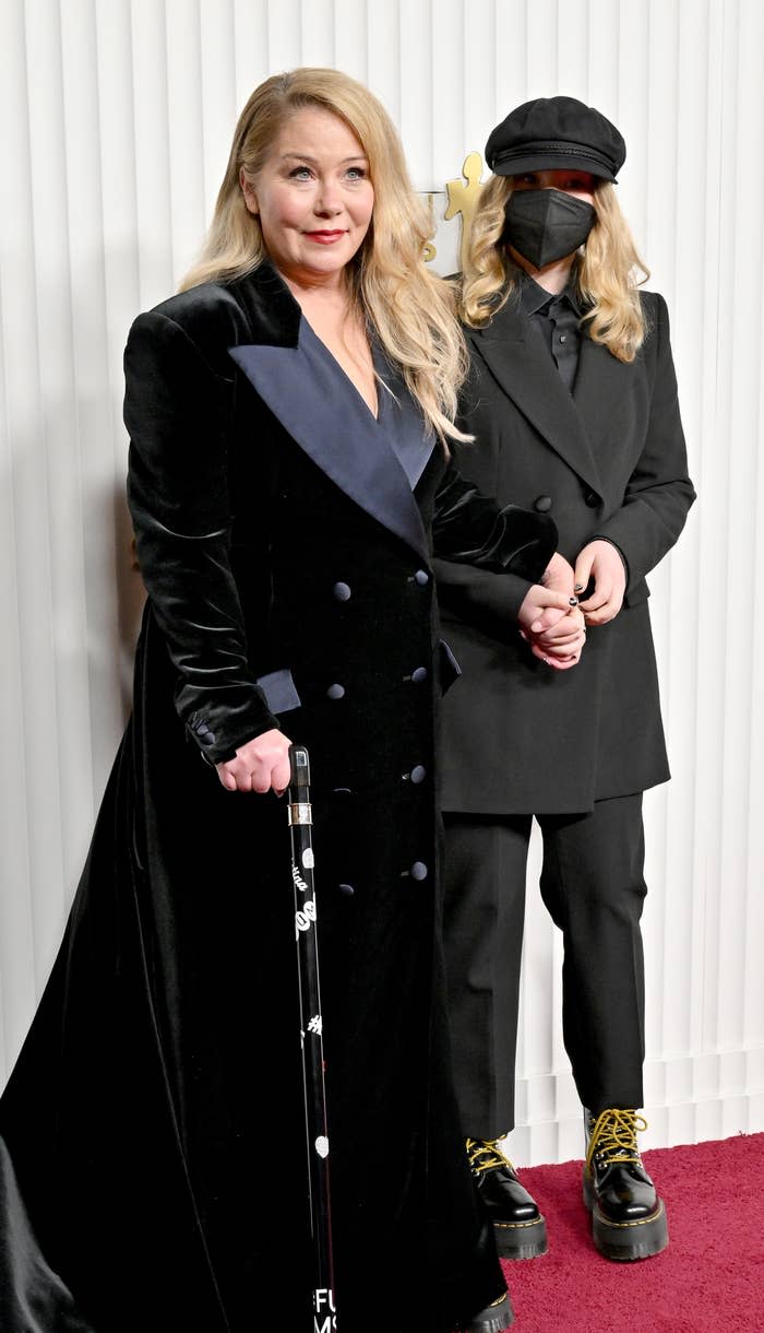 closeup of her on the red carpet in a long velvet dress with her cane