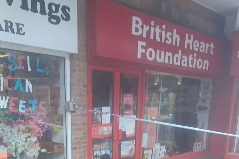 A British Heart Foundation charity shop in Rhyl, taped off by police