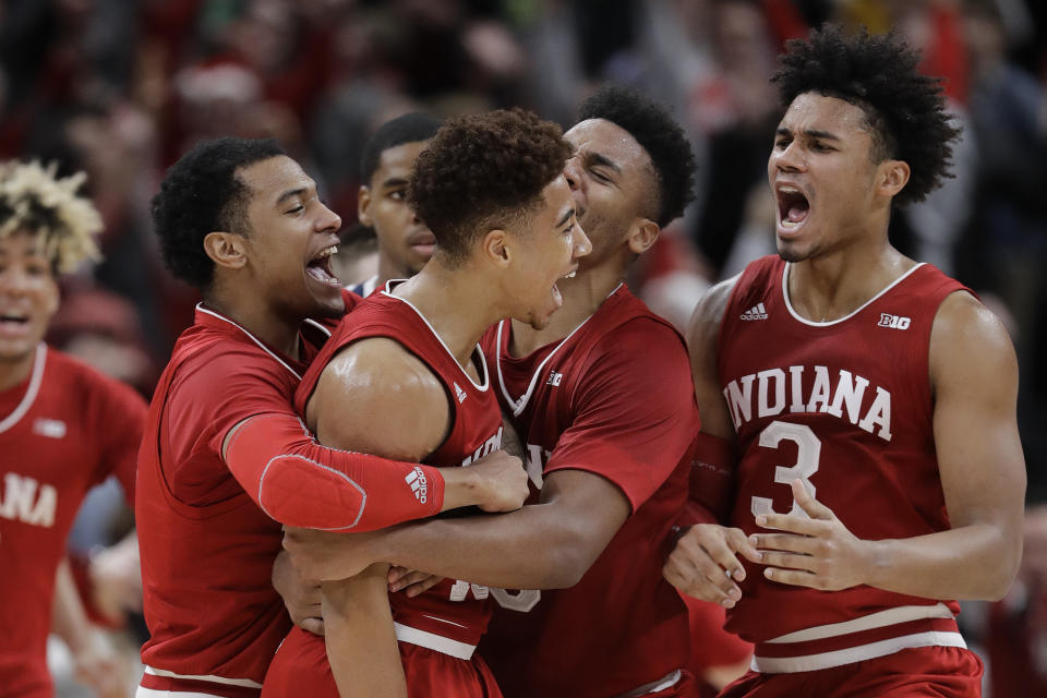 Indiana’s Rob Phinisee, middle, celebrates after hitting the game-winning shot as time expired during an NCAA college basketball game against Butler, Saturday, Dec. 15, 2018, in Indianapolis. Indiana won 71-68. (AP Photo/Darron Cummings)