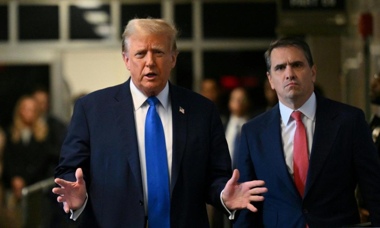 <span>Donald Trump, flanked by lawyer Todd Blanche, speaks on his way into court on Monday.</span><span>Photograph: Angela Weiss/UPI/Rex/Shutterstock</span>