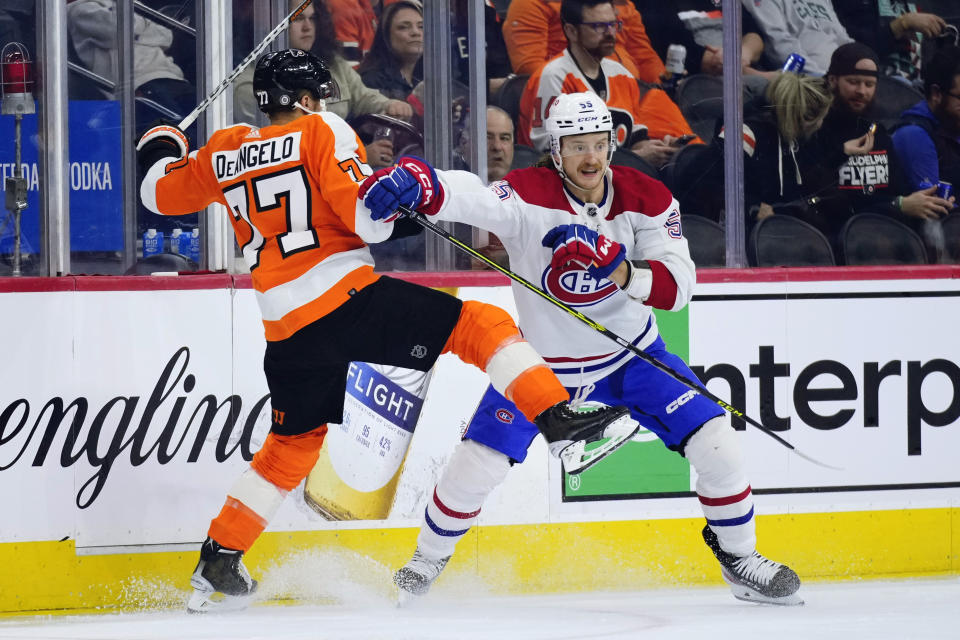 Philadelphia Flyers' Tony DeAngelo, left, and Montreal Canadiens' Michael Pezzetta collide during the first period of an NHL hockey game, Tuesday, March 28, 2023, in Philadelphia. (AP Photo/Matt Slocum)