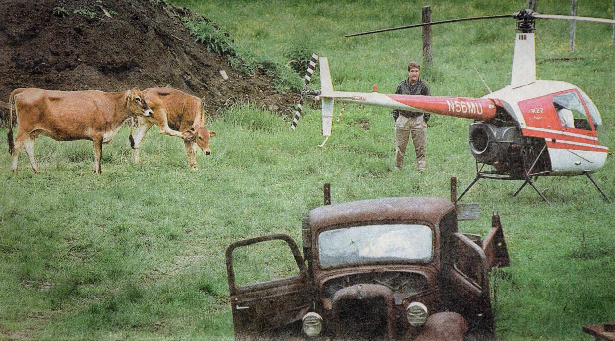 LANCASTER -  A helicopter stolen from Norwoord Airport sits in a field on Russell Bashaw's farm in May 2000.