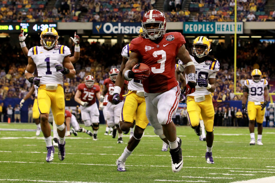 NEW ORLEANS, LA - JANUARY 09: Trent Richardson #3 of the Alabama Crimson Tide runs for a 34 yard touchdown in the fourth quarter against Morris Claiborne #17 of the Louisiana State University Tigers during the 2012 Allstate BCS National Championship Game at Mercedes-Benz Superdome on January 9, 2012 in New Orleans, Louisiana. (Photo by Ronald Martinez/Getty Images)