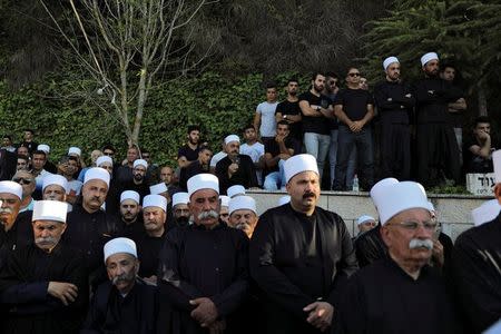 Members of the Druze community attend the funeral of Israeli Druze police officer Kamil Shanan in the village of Hurfeish, Israel July 14 2017 REUTERS/Ammar Awad