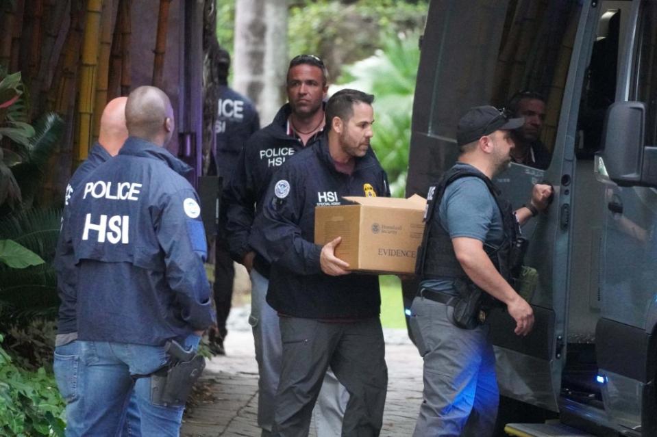 Feds raiding Diddy’s home last Monday. MEGA