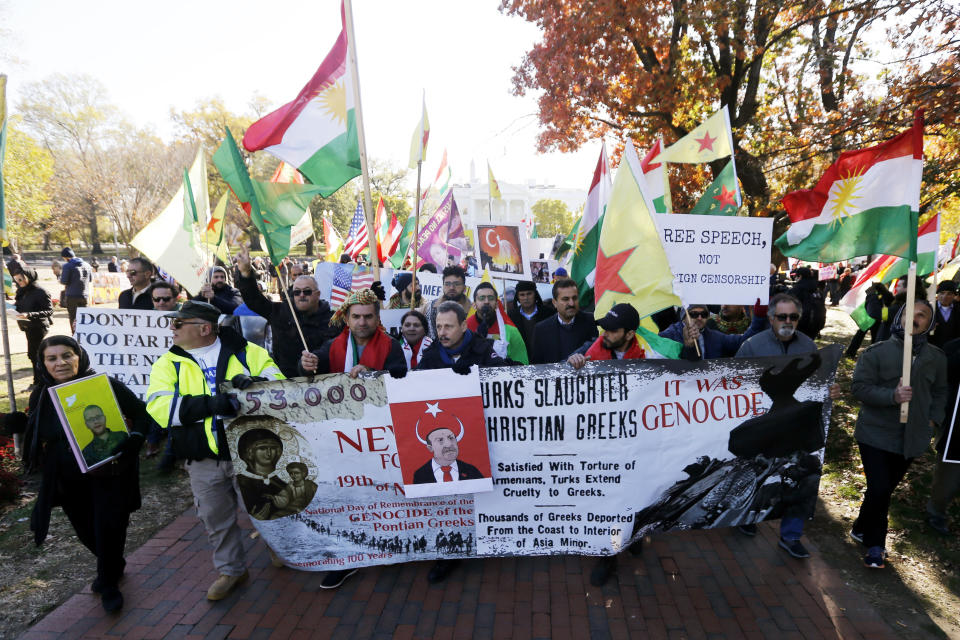 Protesters rally against the Washington visit of Turkish President Recep Tayyip Erdogan outside the White House, Wednesday, Nov. 13, 2019, in Washington. (AP Photo/Steve Helber)