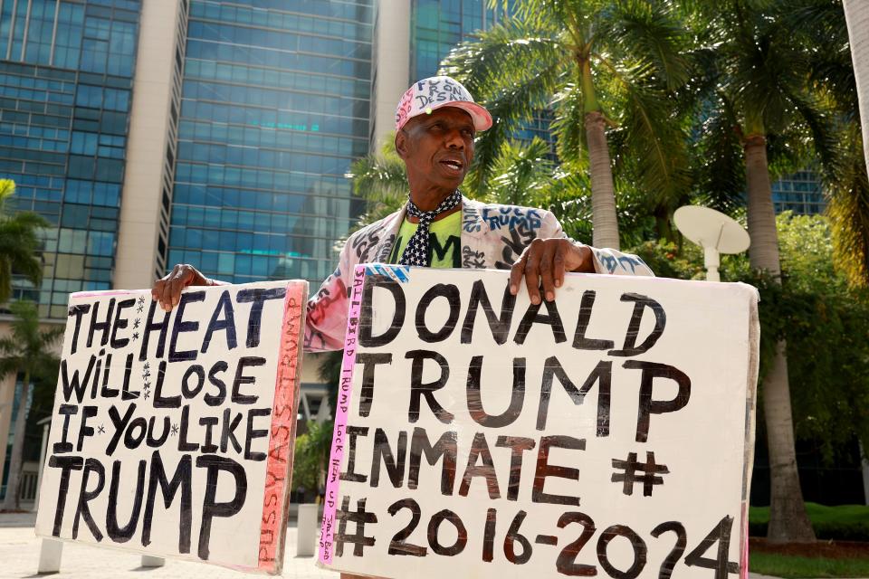 MIAMI, FLORIDA - JUNE 09: (EDITORS NOTE: Image contains profanity.) Xavier Presley protests in front of the Wilkie D. Ferguson Jr. United States Federal Courthouse where former President Donald Trump may appear on June 09, 2023 in Miami, Florida. Trump is reported to have been indicted by a federal grand jury as part of special counsel Jack Smith’s investigation into Trump's handling of classified documents. (Photo by Joe Raedle/Getty Images) ORG XMIT: 775988595 ORIG FILE ID: 1497268579