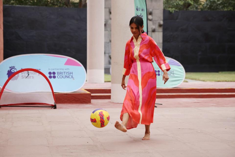 Prime Minister Rishi Sunak’s wife Akshata Murty plays football with local schoolchildren at the British Council during an official visit ahead of the G20 Summit in New Delhi (PA)