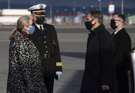 Estrid Brekkan, Icelandic Chief of Protocol, left, and Captain Jon Gudnason, base commander, greet US Secretary of State Antony Blinken, second right, as he disembarks his airplane upon arrival at Keflavik Air Base in Iceland, May 17, 2021, his second stop on a 5-day European tour. (Saul Loeb/Pool Photo via AP)