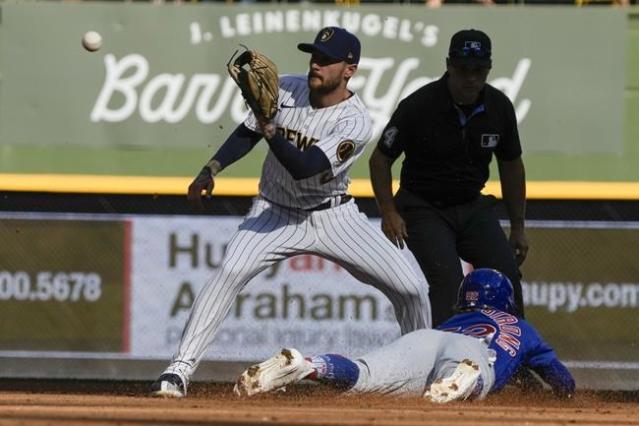 Taylor homers, Houser pitches NL Central champion Brewers past