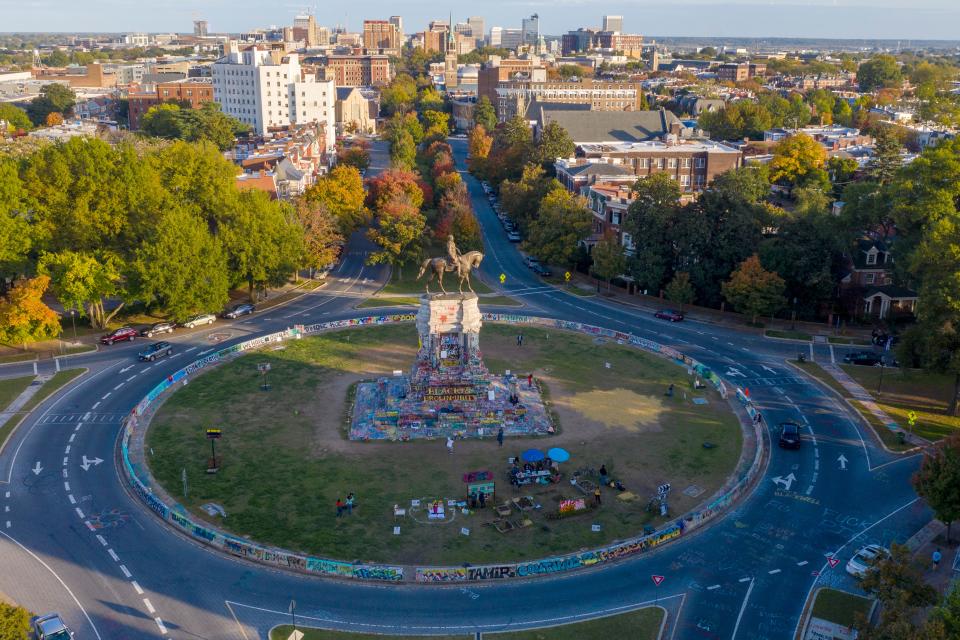 The afternoon sun illuminates the statue of Robert E. Lee on Monument Avenue in Richmond, Virginia, in this Oct. 19, 2020, photo.