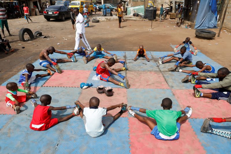 Kid boxers train at an outdoor boxing gym in Adura playground, in Lagos