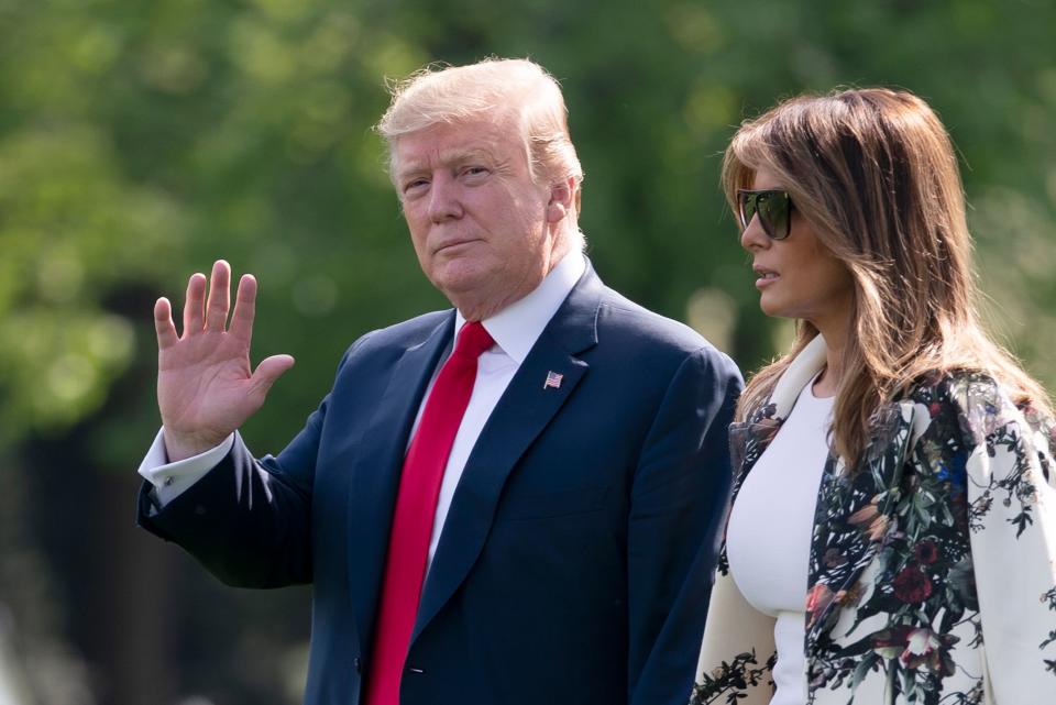 Without taking questions from reporters about the Mueller report, President Donald Trump and first lady Melania Trump walk to board Marine One for a short trip to Joint Base Andrews then on to his estate in Palm Beach, Fla., at the White House in Washington on Thursday, April 18, 2019.