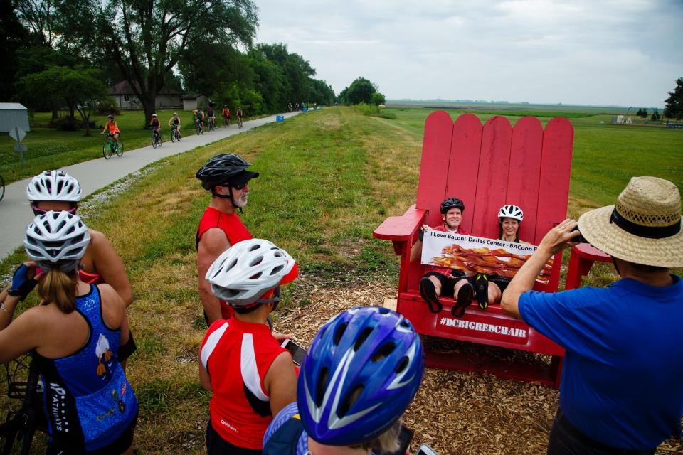 Cyclists pause to take a photo as they make their way to Dallas Center on the Raccoon River Valley Trail during the annual BACooN ride.