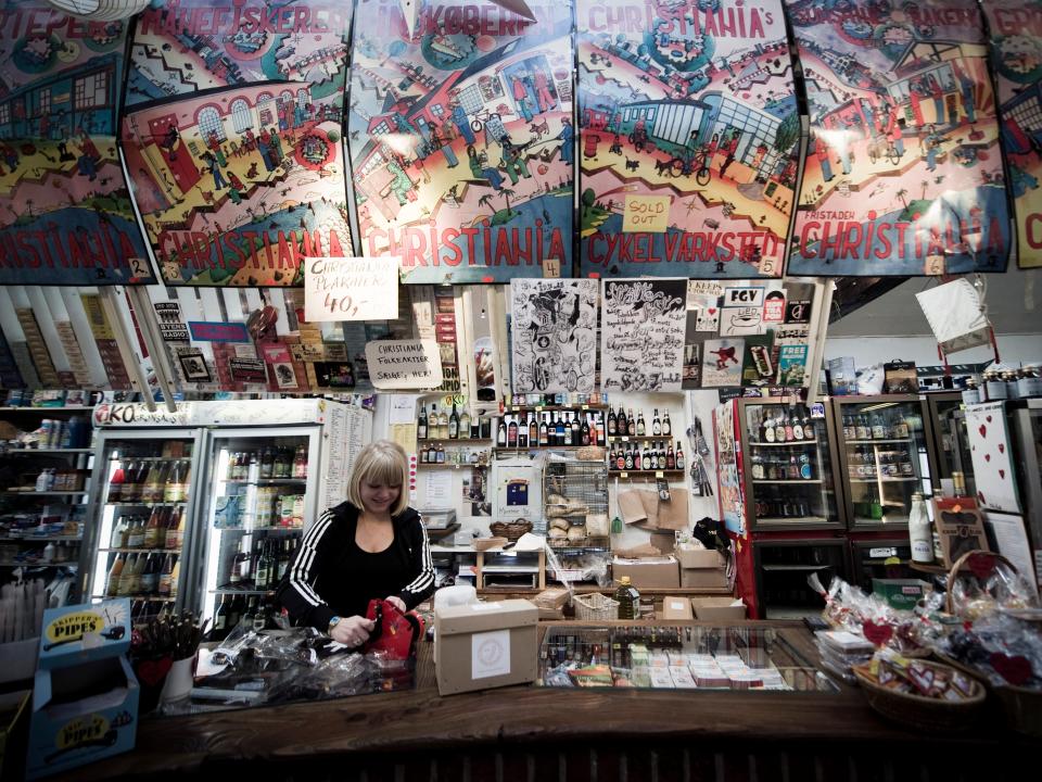 A woman works at a local grocery store inside Christiania in 2012.