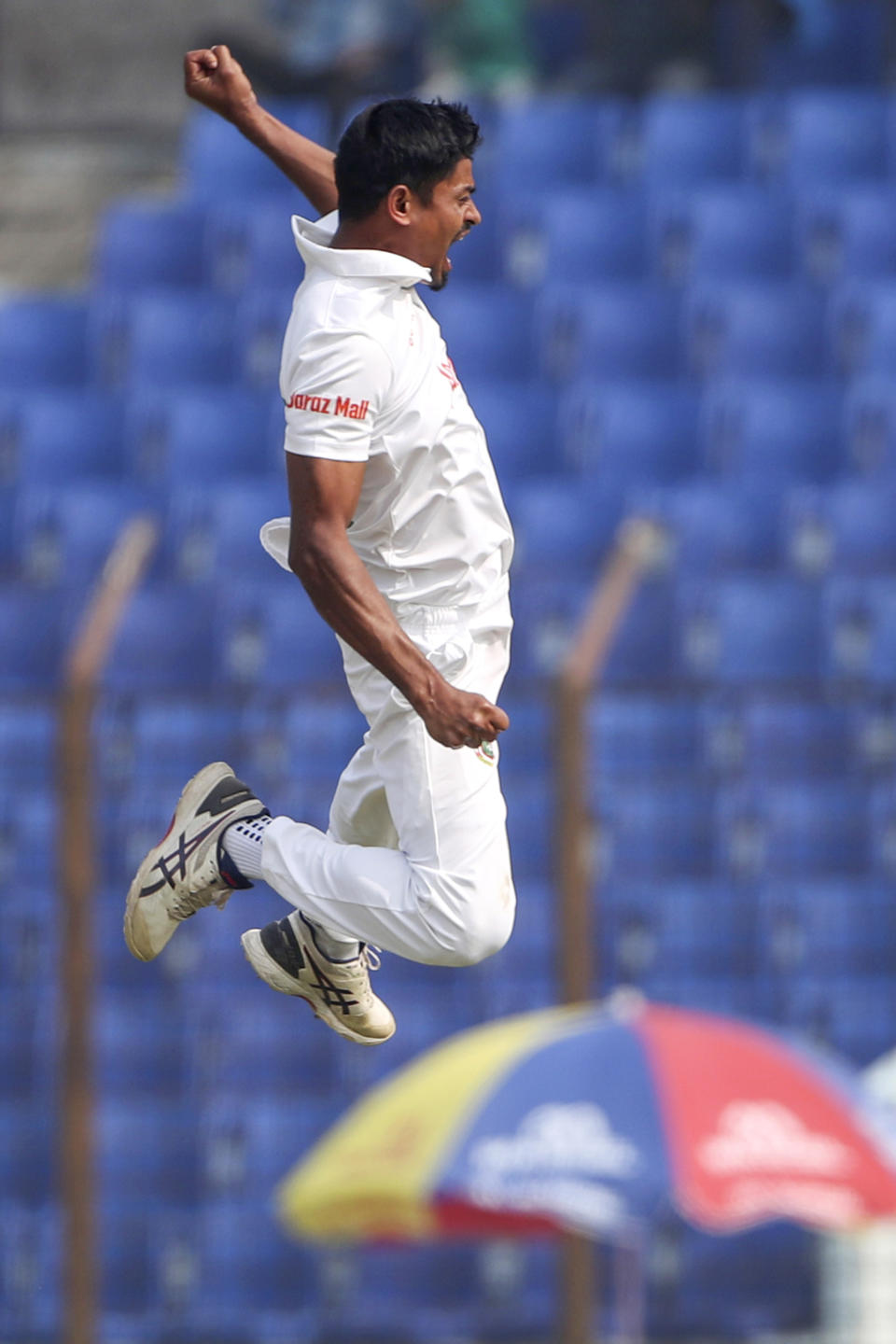 Bangladesh's Taijul Islam celebrates the wicket of India's Virat Kohli during the first day of the first test cricket match between Bangladesh and India in Chattogram, Bangladesh, Wednesday, Dec. 14, 2022. (AP Photo/Surjeet Yadav)