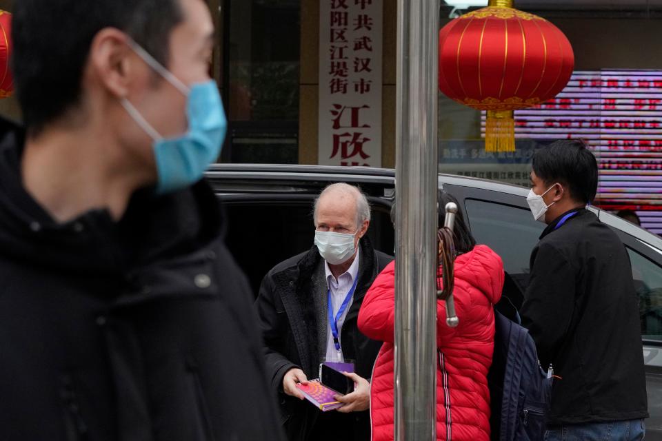 A member of the World Health Organization team arrives for a field visit at the Service Center for Party Members and Residents of Jiangxinyuan Community in Wuhan, China,  Feb. 4, 2021.