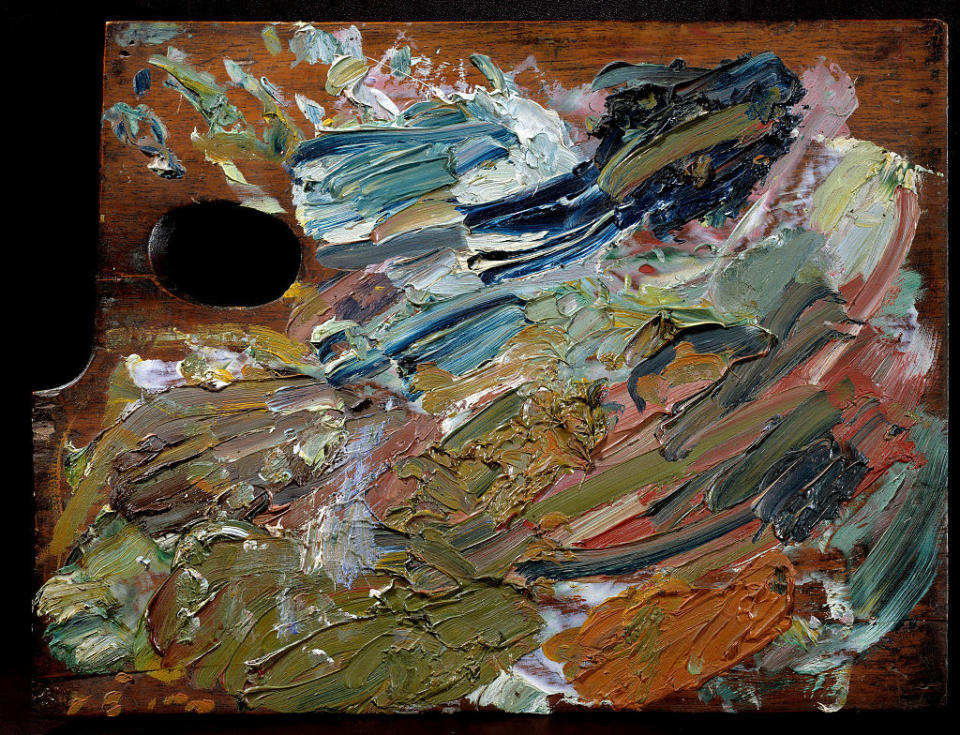 a palette with a variety of colored paint