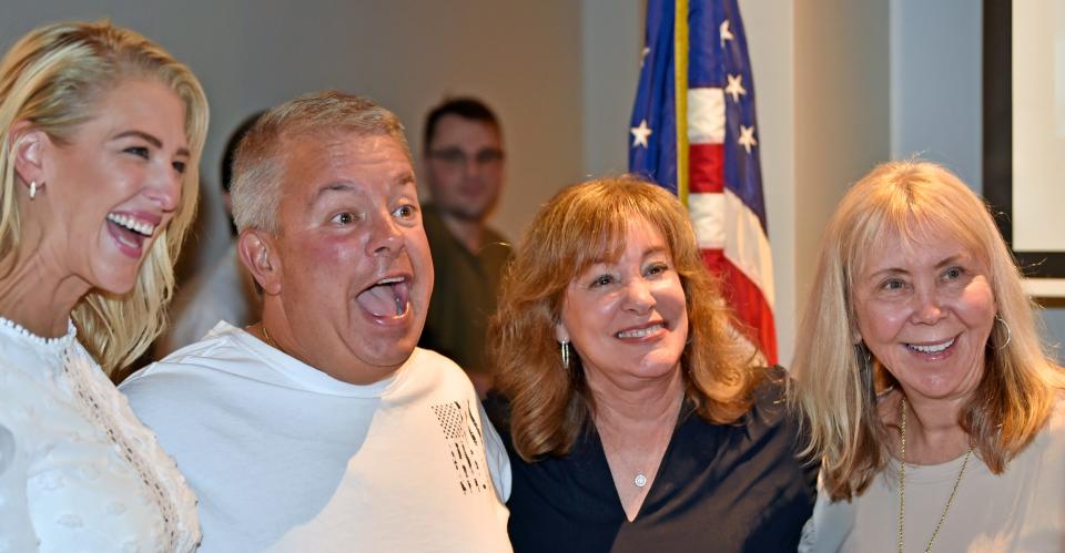 Bridget Ziegler, left, Tim Enos, Robyn Marinelli and Karen Rose celebrate Sarasota County School Board election results on Aug. 23, 2022. Ziegler was reelected while Enos and Marinelli won board seats, allowing the trio to join with Rose in forming a conservative supermajority on the five-member School Board.