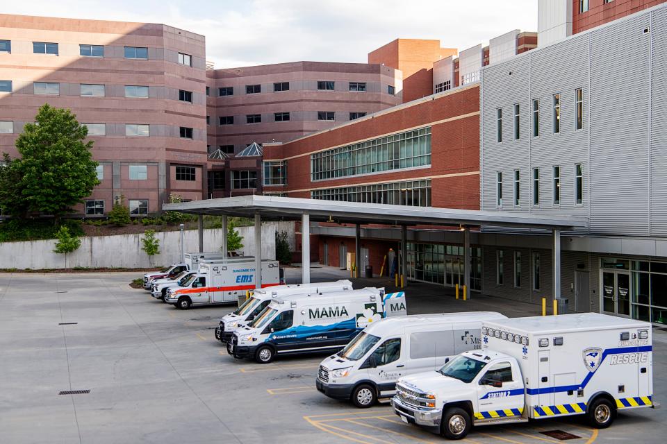 Ambulances are parked at Mission Hospital’s emergency room July 19, 2023.