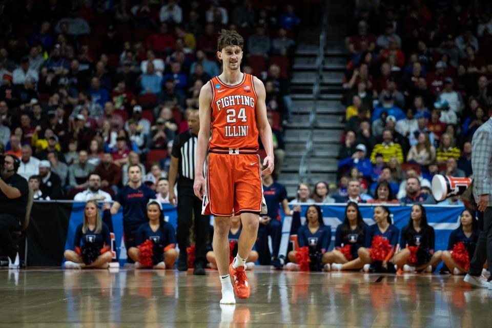 Illinois' Matthew Mayer plays with only one shoe after it fell off during the NCAA Tournament first-round matchup between Illinois and Arkansas.