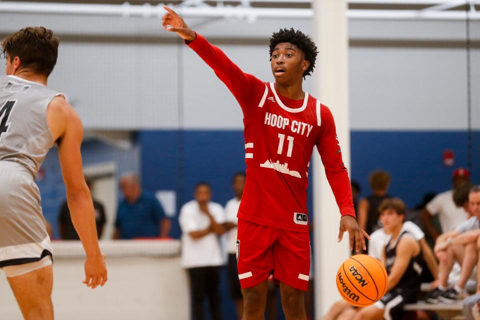 Hoop City Elite’s K.J. Tenner (11) shouts to a teammate while dribbling the ball during the game between Hoop City Elite and Fundamental U at Memphis Live in Memphis, Tenn., on Friday, July 14, 2023.