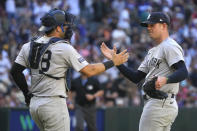 New York Yankees catcher Austin Wells (28) and pitcher Clay Holmes celebrate the team's 6-5 win over the Arizona Diamondbacks in 11 innings in a baseball game Wednesday, April 3, 2024, in Phoenix. (AP Photo/Rick Scuteri)