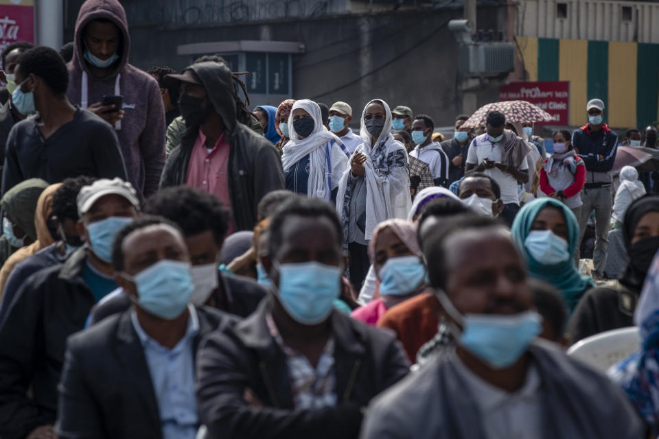 FILE - In this Monday, June 21, 2021 file photo, Ethiopians queue on the street as they wait to cast their votes in the general election at a polling center in the capital Addis Ababa, Ethiopia Monday, June 21, 2021. Ethiopia's ruling Prosperity Party was declared on Saturday, July 10, 2021 the winner of last month's national election in a landslide, assuring a second term for Prime Minister Abiy Ahmed. (AP Photo/Ben Curtis, File)