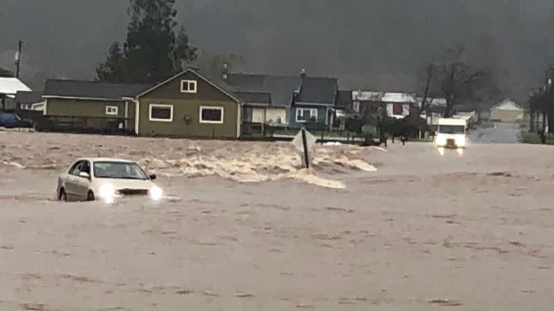 Tillamook firefighters save 2 people from car trapped in flood water