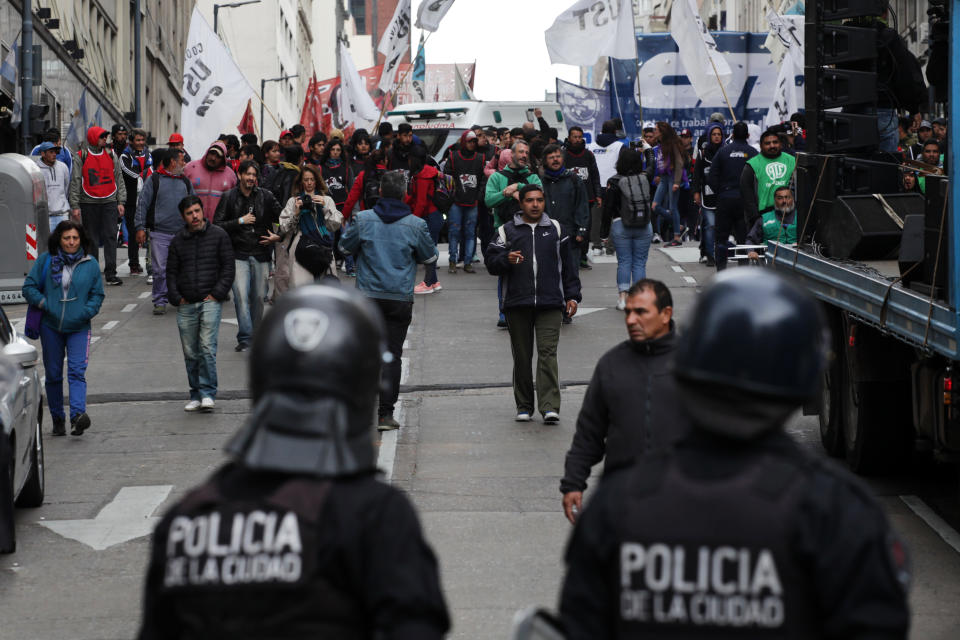 Police take security measures as demonstrators gather against the economic policies of the government of Argentine President Mauricio Macri during a protest on August 30, 2019, in Buenos Aires. (Photo by Carol Smiljan/NurPhoto via Getty Images)