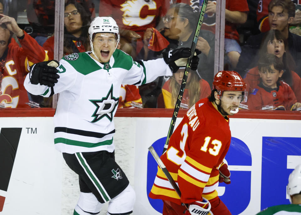 Dallas Stars forward Vladislav Namestnikov, left, celebrates his goal as Calgary Flames forward Johnny Gaudreau skates away during second period NHL playoff hockey action in Calgary, Alberta, Sunday, May 15, 2022. (Jeff McIntosh/The Canadian Press via AP)