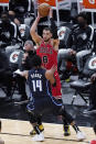 Chicago Bulls guard Zach LaVine (8) looks to pass the ball as Orlando Magic guard Gary Harris (14) defends during the first half of an NBA basketball game in Chicago, Wednesday, April 14, 2021. (AP Photo/Nam Y. Huh)